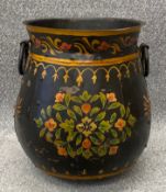 A panelled, riveted and hand painted floral iron bargeware crock pot. H.42 Dia.35cm