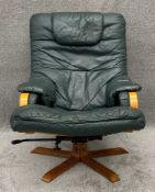 A 1970's vintage Scandinavian bent ply and green leather reclining armchair. H.96 W.73 D.91cm
