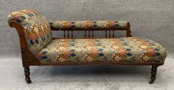 A Victorian carved walnut framed chaise longue in Liberty print upholstery. H.81 W.172 D.72cm