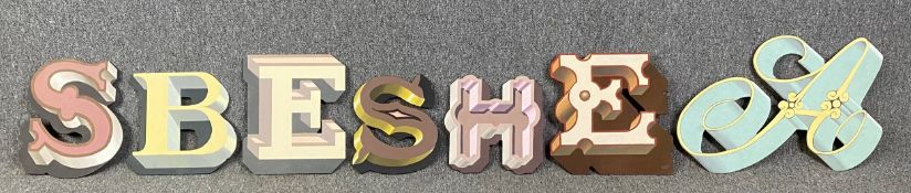 A collection of contemporary signage letters in various 3-D stylised designs hand painted on