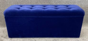 A contemporary blue velour ottoman by Oliver Bonas. H.51 W.120 D.41cm