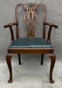 A 19th century mahogany Chippendale style carver chair with faux leather upholstery. H.99 W.67 D.