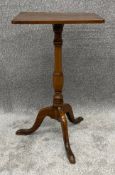 A 19th century oak lamp table on tripod base. H.72 W.42 D.34cm