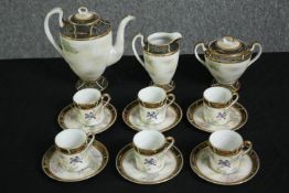 A Japanese tea service, with painted bird decoration. H.18cm. (largest).