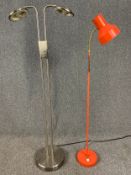 A vintage floor standing adjustable spotlight and a contemporary chrome double spot lamp. H.136cm (