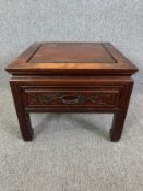 A carved Chinese hardwood occasional or lamp table. H.41 W.51 D51cm