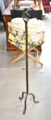 A wrought iron pricket candlestick. H.116cm