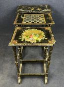A late 19th century nest of three graduating occasional tables, hand decorated and mother of pearl