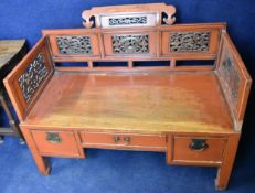 A 19th century red lacquered Chinese bench. (Damage to one panel as seen). W.113cm