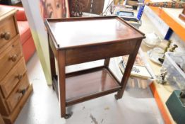 A vintage mahogany two tier trolley on casters. H.60 W.73 D.37cm