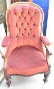 A Victorian mahogany framed library armchair.