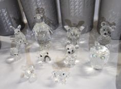 A collection of nine boxed Swarovski crystal figures