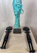 A pair of carved African fertility figures and a painted carved African bust on stand. H.28cm