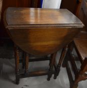 An oak drop flap occasional table. W.59cm