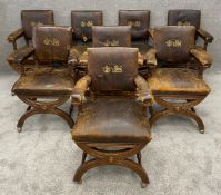 A set of eight 19th century oak X framed armchairs in original leather upholstery with embossed