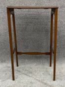 An Edwardian mahogany and satinwood strung occasional table. (From a nest of tables). H.64 W.41 D.