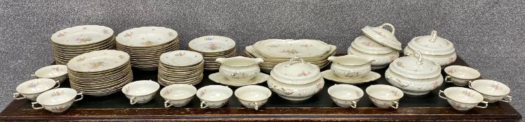 A large Rosenthal hand painted dinner service with a floral design and gilt decoration. Twelve