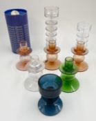 A collection of eight Wedgwood glass candle holders; two with maker's labels, one of which is boxed.