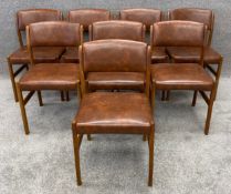 A set of eight mid century teak Danish dining chairs in faux leather upholstery. H.77cm (each)