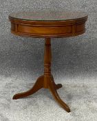 A Georgian style teak drum table. H.63 Dia.53cm