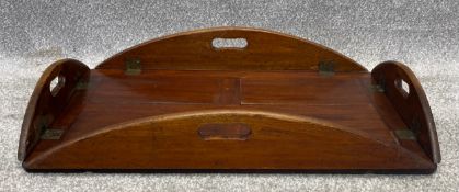 A Georgian mahogany butlers tray with four brass hinged flaps. W.71 D.47cm