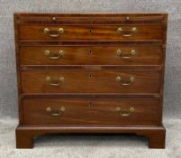 A Georgian mahogany bachelor's chest fitted with brushing slide. H.80 W.88 D.48cm
