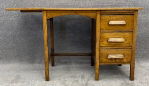 A C.1900 oak student's kneehole desk. H.71 W.93 (122 extended) x D.52cm