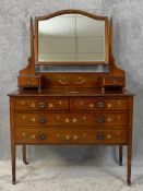 An Edwardian mahogany and satinwood inlaid dressing table later hand decorated with scrolling