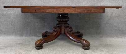 A William IV mahogany dining table with extending superstructure to support two extra leaves
