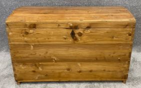 A 19th century pine domed top coffer. H.60 W.94 D.54cm