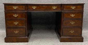 A mid Georgian style burr walnut and crossbanded partner's desk fitted with drawers opposing