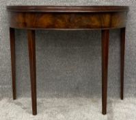 A Georgian mahogany demi-lune tea table with foldover gateleg action. H.71 W.90 D.82cm