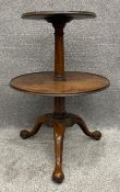 A Georgian mahogany two-tiered dumb waiter. H.88 Dia.63cm