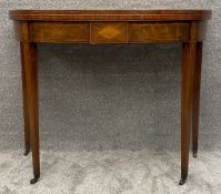 A Georgian mahogany tea table with satinwood and ebony inlay and foldover gateleg action. H.74 W.