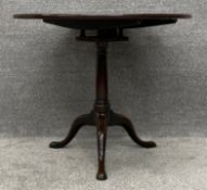 A Georgian mahogany occasional table with tilt top birdcage action.H.70 Dia.81cm