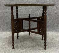 An early 20th century Benares tray top occasional table on carved folding base. H.53 Dia.65cm