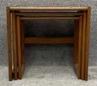 A nest of three mid century teak G-Plan style graduating occasional tables. H.49 W.53 D.43cm (