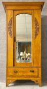 A late 19th century satin walnut wardrobe with Art Nouveau style foliate carving. H.194 W.98 D.47cm