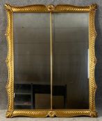 A 19th century carved giltwood wall mirror with original twin plates. H.133 D.107cm
