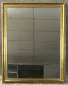 A contemporary gilt framed mirror with a bevelled plate. H.132 W.103cm