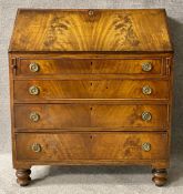 A Georgian flame mahogany bureau with fitted interior. H.105 W.90 D.47cm