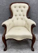 A Victorian mahogany armchair reupholstered in piped calico. H.105 W.70 D.80cm