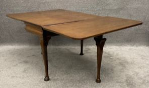 A C.1900 Georgian style mahogany drop flap dining table on cabriole supports. H.72 W.55 (182