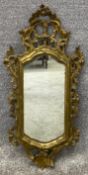 A 19th century carved giltwood Florentine style wall mirror fitted with it's original plate. H.82cm
