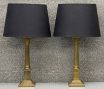 A pair of contemporary brass neo classical Corinthian column style table lamps by Laura Ashley. Both