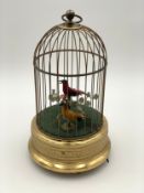 A mid 20th century West German singing twin bird cage music box automaton. Wind-up with