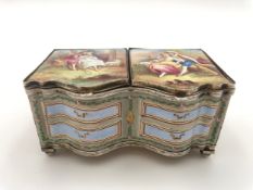 A 19th century Viennese enamel pill box in the form of a commode chest bound in silver, hand