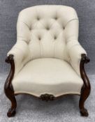 A Victorian mahogany armchair reupholstered in piped calico. H.89 W.69 D.86cm