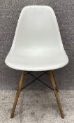 An Vitra moulded Eiffel style chair by Charles and Ray Eames with maker's mark to underside. H.81
