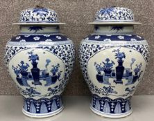 A pair of large contemporary Chinese blue and white temple jars .H.42cm (each)